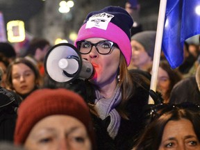 Protesters take part in a Women's Day march in Warsaw, Poland, Thursday, March 8, 2018. A few thousand women and men chanting women's rights slogans marched through  central Warsaw to mark the International Women's Day.