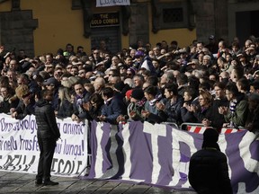 People attend the funeral ceremony of Italian player Davide Astori in Florence, Italy, Thursday, March 8, 2018. The 31-year-old Astori was found dead in his hotel room on Sunday after a suspected cardiac arrest before his team was set to play an Italian league match at Udinese.