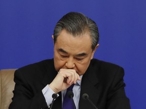 China's Foreign Minister Wang Yi pauses as he listens to a question from a journalist during a press conference on the sidelines of the National People's Congress at the media center in Beijing, Thursday, March 8, 2018. China says its proposal for a "dual suspension" of North Korean nuclear tests in return for a halt to war games by South Korea and the U.S. has proven successful. Wang on Thursday told reporters that the suspension of such activities during the recent Winter Olympic Games in Pyeongchang, South Korea showed that China's approach "was the right prescription for the problem and created basic conditions for the improvement of inter-Korean relations."