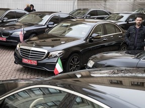 Cars and limousines of invited foreign ambassadors in Moscow are parked as foreign envoys attend attend briefing at Russian Foreign Ministry building in Moscow, Russia, Wednesday, March 21, 2018. A Russian foreign ministry official says Moscow fears that Britain could destroy key evidence in the nerve agent attack on an ex-Russian spy.