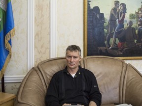 In this photo taken on Monday, Feb. 12, 2018, Yekaterinburg mayor Yevgeny Roizman talks to The Associated Press in his office in Yekaterinburg, Russia. Yekateringburg mayor Yevgeny Roizman openly criticizes President Vladimir Putin and has called for a boycott of Sunday's presidential vote, a move advocated by Russian opposition leader Alexei Navalny, who is banned from running.