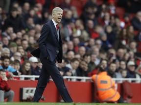 Arsenal French manager Arsene Wenger yells during the English Premier League soccer match between Arsenal and Watford at the Emirates stadium in London, Sunday, March 11, 2018.
