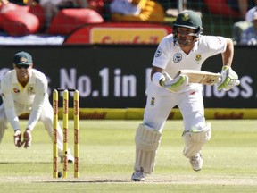 South Africa's Dean Elgar makes a run on the second day of the second cricket test between South Africa and Australia at St. George's Park in Port Elizabeth, South Africa, Saturday, March 10, 2018.