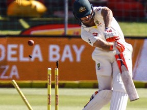 Australia's Mitchell Marsh is bowled out by South Africa's Kagiso Rabada on the fourth day of the second cricket test between South Africa and Australia at St. George's Park in Port Elizabeth, South Africa, Monday, March 12, 2018.