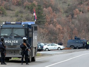 Kosovo police block road near the northern, Serb-dominated part of Mitrovica, Kosovo, Monday, March 26, 2018. Serbian state television says Kosovo police have arrested one Serb official and fired tear gas and stun grenades at Serb protesters in northern Kosovo.
