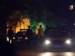 A convoy under heavy security is seen passing into the Diaoyutai State Guesthouse where top North Korean leaders have stayed on previous trips to Beijing, China, Monday, March 26, 2018. Japanese media reports said a special North Korean train arrived in Beijing under unusually heavy security on Monday, suggesting a senior delegation might have been aboard.