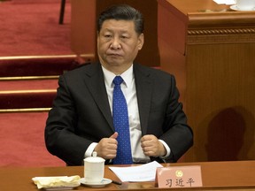 In this Saturday, March 3, 2018, photo, Chinese President Xi Jinping attends the opening session of the Chinese People's Political Consultative Conference in Beijing's Great Hall of the People. Xi is poised to make a historic power grab as China's legislators gather from Monday and prepare to approve changes that will let him rule indefinitely and undo decades of efforts to prevent a return to crushing dictatorship.