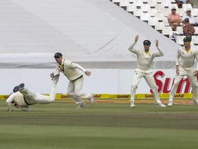 Usman Khawaja of Australia drop a catch on the third day of the third cricket test between South Africa and Australia at Newlands Stadium, in Cape Town, South Africa, Saturday, March 24, 2018.