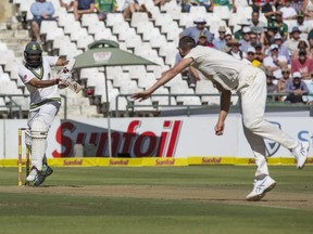 Hashim Amla of South Africa smashes a ball towards the boundary off the bowling Josh Hazlewood of Australia during a Five Day Test Match between South Africa and Australia at Newlands Stadium, in Cape Town, South Africa, Thursday, March 22, 2018.