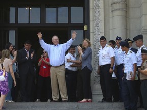 In this photo provided by Peru's presidential press office, Peru's President Pedro Pablo Kuczynski waves to government workers and supporters outside the House of Pizarro government palace and presidential residence one day after offering his resignation in Lima, Peru, Thursday, March 22, 2018. Kuczynski announced his decision to resign in a nationally televised address, accusing opponents of plotting his overthrow for months and making it impossible to govern. Lawmakers are slated to debate whether or not to accept his resignation on Thursday. (Peruvian presidential press office via AP)