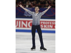 U.S. Vincent Zhou celebrates after performing during mens's short program at the Figure Skating World Championships in Assago, near Milan, Thursday, March 22, 2018.