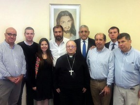 This photo released by Francisco Arevalo shows Archbishop Charles Scicluna, center, posing for a photo with members of the religious Marist congregation, after Isaac Givovich, fourth from left, gave his testimony as part of his child sex abuse investigation in Santiago, Chile, Tuesday, Feb. 27, 2018. Scicluna, an envoy sent by Pope Francis, is gathering testimonies regarding Bishop Juan Barros allegedly covering up sexual abuses committed by Vatican-condemned priest Fernando Karadima. Second from left is Spanish Priest Jordi Bartolomeu who is assisting Scicluna. The rest are members of the religious Marista congregation: Jaime Concha, far left, Asuncion Lavin, third from left, Eduardo Arevalo, fourth from right, Jorge Franco, third from right, Juan Pablo Arevalo, second from right, and Gonzalo Dezerega, far right.