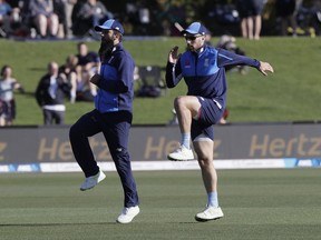 England's Jack Leach, right, warms up with teammate Moeen Ali ahead of play on day one of the second cricket test against New Zealand at Hagley Oval in Christchurch, New Zealand, Thursday, March 29, 2018.