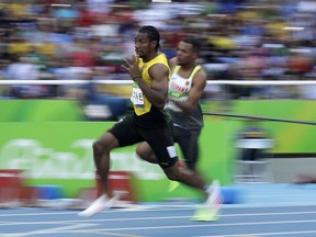 FILE - In this Aug. 16, 2016, file photo, Jamaica's Yohan Blake competes in a men's 200-meter heat during the athletics competitions of the 2016 Summer Olympics at the Olympic stadium in Rio de Janeiro, Brazil. More than 6,600 athletes and officials from across the world will converge on the Gold Coast for the 21st edition of the Commonwealth Games, the quadrennial multi-sports event for 71 countries and territories of the British Commonwealth.