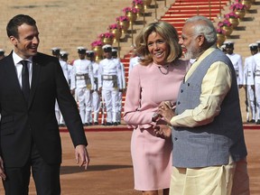 French President Emmanuel Macron, left, and wife Brigitte talks to Indian Prime Minister Narendra Modi during the ceremonial reception of Macron at the Indian presidential palace in New Delhi, India, Saturday, March 10, 2018. Macron who is on a four-day state visit is expected to hold talks with Indian Prime Minister Narendra Modi and co-chair the Founding Conference of the International Solar Alliance.