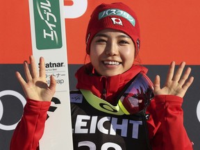 Japan's Sara Takanashi  celebrates after she won the Ladies' Ski Jumping World Cup in Oberstdorf, Germany, Saturday, March 24, 2018.