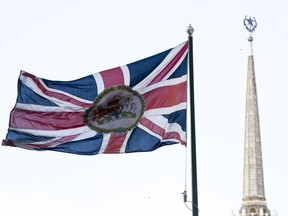 British national flag flutters in front of the British Embassy with the Ukraine Hotel, right, in the background, in Moscow, Russia, Friday, March 16, 2018. Russia's Foreign Minister Sergey Lavrov on Friday accused Britain of violating international law and criticized Britain's defense minister for what he called "uneducated" comments about Russia.