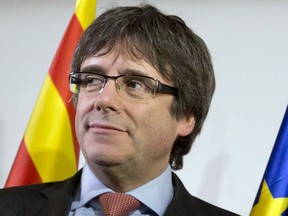 FILE - In this Dec. 21, 2017 file photo ousted Catalan leader Carles Puigdemont takes the podium at a gathering to watch the election results for Spain's Catalonia region at the Square Meeting Center in Brussels. The lawyer for fugitive former Catalan leader Carles Puigdemont says that he is being held by German police. Jaume Alonso-Cuevillas has confirmed to The Associated Press that German police stopped Puigdemont on Sunday, March 25, 2018  when he was crossing the border from Denmark.