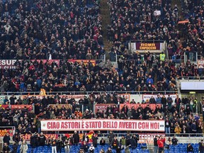 AS Roma's supporters hold up a banner with writing reading "Bye Astori, it was nice having you with us" as one minute of silence was observed in memory of Fiorentina captain Davide Astori ahead of a Serie A soccer match between AS and Torino, at the Olympic stadium, in Rome, Friday, March 9, 2018. The 31-year-old Astori was found dead in his hotel room on Sunday after a suspected cardiac arrest before Fiorentina was to play an Italian league match at Udinese.
