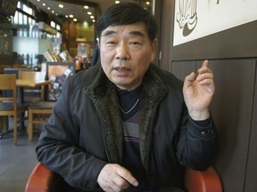 In this Jan. 29, 2018, photo, Kim Paolo speaks during an interview in Bucheon, South Korea. When South Korea previously held the Olympics in 1988, Kim Paolo and some 150 other poor urban residents spent months that year hiding in huge graves of their own making. They were the last among thousands ousted from host city Seoul after losing years-long pre-Olympic battles against officials, police, construction workers and hired thugs. A massive effort to beautify the capital had razed hundreds of poor neighborhoods to make way for new high-rise buildings. In violent clashes between residents and police, several died and hundreds were injured.