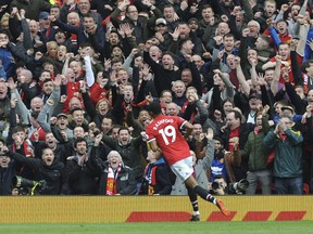 Manchester United's Marcus Rashford celebrates after scoring his sides second goal during the English Premier League soccer match between Manchester United and Liverpool at Old Trafford in Manchester, England, Saturday, March 10, 2018.