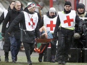 Atletico's Filipe Luis is stretchered off after sustaining an injury during the Europa League, round of 16 second leg soccer match between Lokomotiv Moscow and Atletico Madrid, in Moscow, Russia, Thursday, March 15, 2018.
