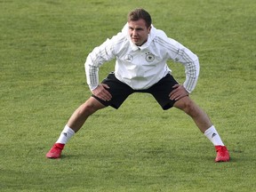 FILE - In this Nov. 8, 2017 file photo, German national soccer player Mario Goetze stretches during a training session of the German national soccer team in Berlin. Germany coach Joachim Loew made no new call-ups on Friday March 16, 2018  for the side's upcoming friendly games against Spain and Brazil, for which Mario Goetze and Marco Reus were left out.