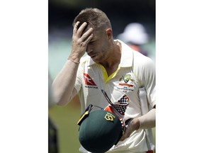 Australia's batsman David Warner leaves the field after being dismissed by South Africa's bowler Kagiso Rabada, for 28 runs on day three of the first cricket test match between South Africa and Australia at Kingsmead stadium in Durban, South Africa, Saturday, March 3, 2018.