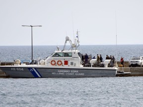 A coast guard vessel arrives with the bodies of migrants at the port of Pythagorio on the eastern Greek island of Samos on Saturday, March 17, 2018. Greece's coast guard said Saturday the bodies of fourteen people have been recovered from the sea off a Greek island in the eastern Aegean following the sinking of a suspected migrant smuggling boat.