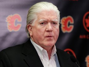 Calgary Flames president of hockey operations Brian Burke answers questions at a press conference in this March 11, 2016 file photo.