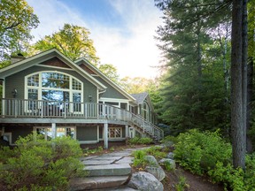 This cottage sits in the midst of wooded Lake Muskoka waterfront.