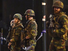 Belgian Army soldiers patrol in front of Central Station in Brussels.