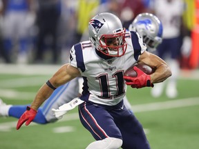In this Aug. 25, 2017 file photo, New England Patriots receiver Julian Edelman runs with the ball in pre-season action against the Detroit Lions.