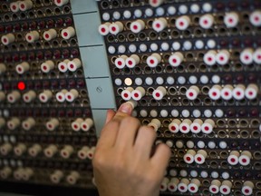 Operations Director at The National Museum of Computing Victoria Alexander demonstrates how the Tunny Machine was used during World War II at Block H, Bletchley Park on June 3, 2016 in Bletchley, England.