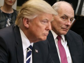 Homeland Security Secretary John Kelly listens as U.S. President Donald Trump delivers remarks at the beginning of a meeting with government cyber security experts in the Roosevelt Room at the White House January 31, 2017 in Washington, DC.