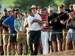 Patrick Reed plays a shot on the 17th hole during the second round of the Masters Tournament on Friday at Augusta National Golf Club in Augusta, Ga.