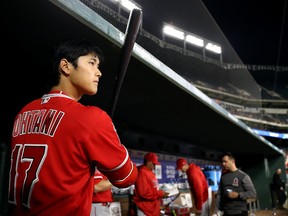 Shohei Ohtani prepares to bat in the seventh inning against the Texas Rangers on April 11, 2018 in Arlington, Texas.