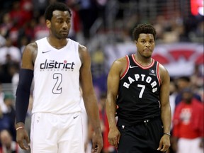 Wizards guard John Wall, left, took over the series in Games 3 and 4 while Raptors guard Kyle Lowry had trouble exerting his influence on the outcomes.
