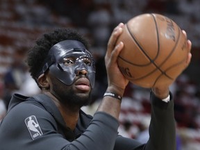 Philadelphia 76ers center Joel Embiid shoots before Game 3 of a first-round NBA basketball playoff series against the Miami Heat, Thursday, April 19, 2018, in Miami.