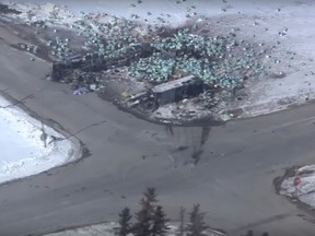 A screen grab from an aerial video of the scene of the crash. The tractor trailer unit lies to the northwest of the bus.