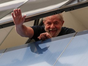 Brazilian former president Luiz Inacio Lula da Silva waves from a window of the Metallurgical Union, in Sao Bernardo do Campo, Sao Paulo state, Brazil, on April 07, 2018.