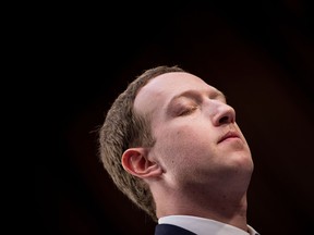 Facebook CEO Mark Zuckerberg listens during a joint hearing of the Senate Commerce, Science and Transportation Committee and Senate Judiciary Committee on Capitol Hill April 10, 2018 in Washington, DC.