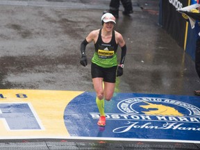 Krista DuChene of Canada crosses the finish line in third place at the 2018 Boston Marathon on April 16, 2018.