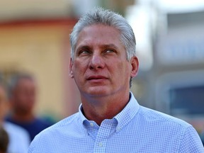 In this file picture taken on March 11, 2018, Miguel Diaz-Canel queues at a polling station in Santa Clara, Cuba, during an election to ratify a new National Assembly.