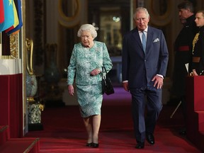 Britain's Queen Elizabeth II and Britain's Prince Charles, Prince of Wales arrive for the formal opening of the Commonwealth Heads of Government Meeting (CHOGM) at Buckingham Palace in London on April 19, 2018.