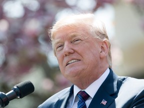 In this file photo taken on April 12, 2018 U.S. President Donald Trump speaks about tax cuts during an event with American workers in the Rose Garden of the White House in Washington, DC.