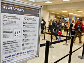 A Transportation Safety Administration (TSA) travel advisory stands at a security check point at Salt Lake International Airport in Salt Lake City, Utah, U.S., on Monday, Dec. 28, 2009.