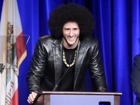 FILE - In this Dec. 3, 2017, file photo, Colin Kaepernick attends the 2017 ACLU SoCal's Bill of Rights Dinner at the Beverly Wilshire Hotel in Beverly Hills, Calif. Human rights organization Amnesty International has honored former NFL quarterback Colin Kaepernick with its Ambassador of Conscience Award for 2018, lauding his peaceful protests against racial inequality. The former San Francisco 49ers star was handed the award at a ceremony Saturday, April 21, 2018 in the Dutch capital by onetime teammate Eric Reid.