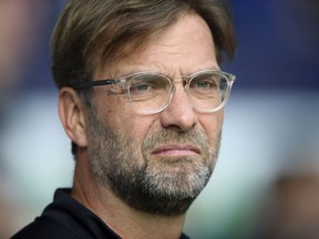 Liverpool manager Jurgen Klopp looks on, during the English Premier League soccer match between West Bromwich Albion and Liverpool, at The Hawthorns, West Bromwich, England, Saturday April 21, 2018.