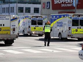 Ambulances stand ready to transport victims of the Yonge Street van attack, which killed 10 and injured 16, on April 24, 2018, in Toronto.